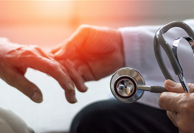 Dr. Holding hand of patient